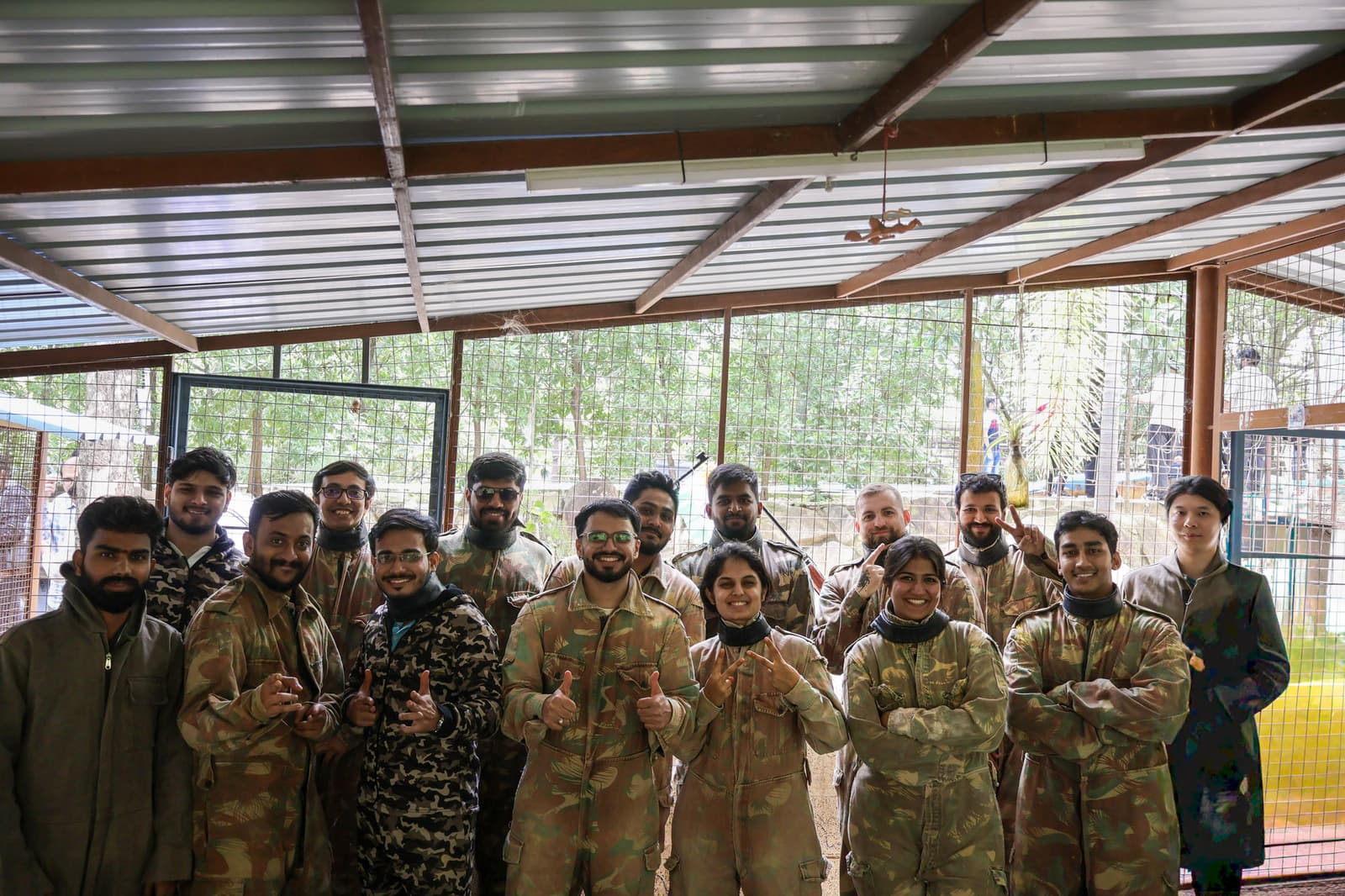 Group photo after a paintball session in jumpsuits