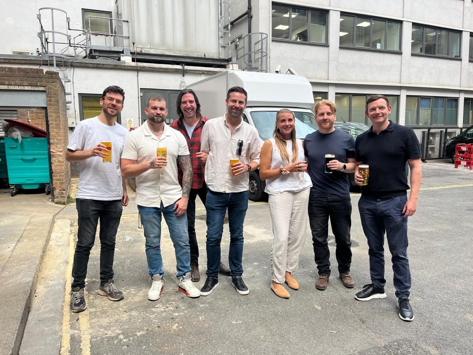 Team enjoying drinks outside after work