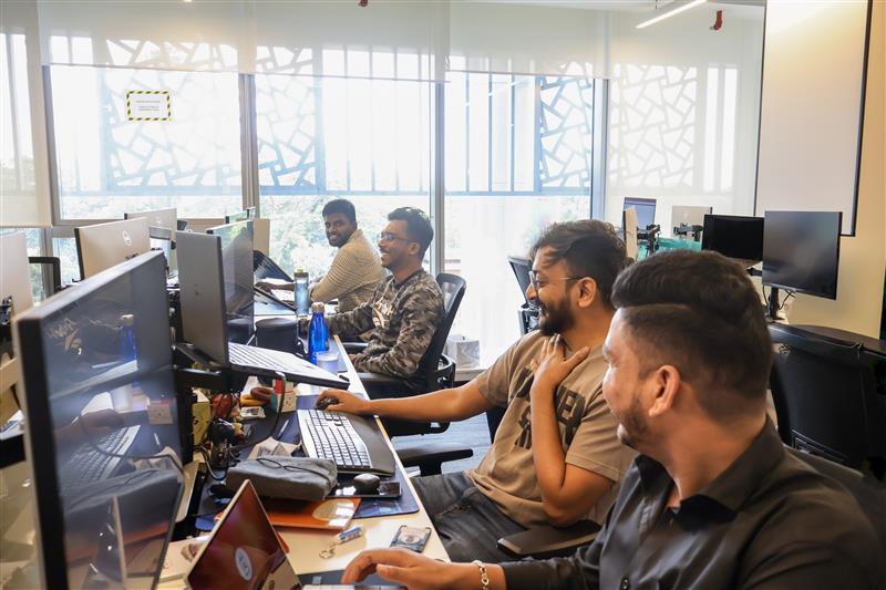 Engineers collaborating at their desks in the Bengaluru office