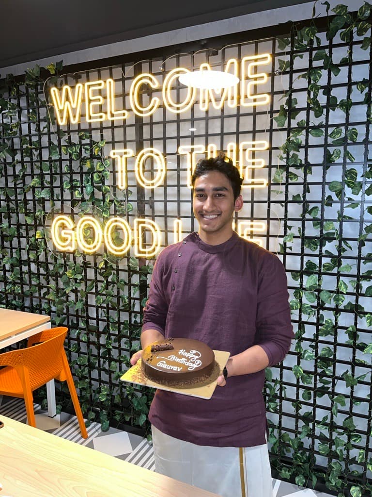 Birthday celebration at the Welcome to the Good Life wall