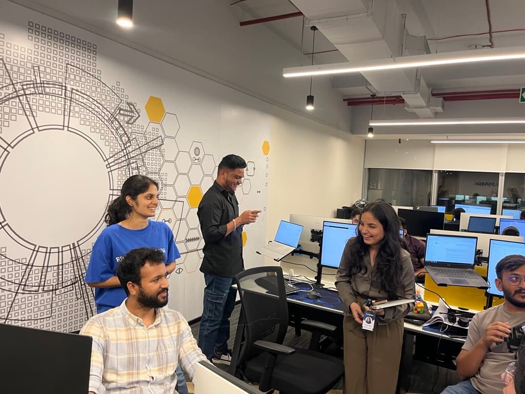 Team members chatting in the Hyderabad workspace